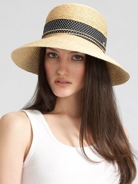 Fine braided raffia accented with polka dot ribbon trim can be worn with brim turned up or rolled down. Bow at back Adjustable sizing cord Brim, about 3½ Imported