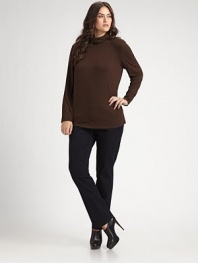 An essential style to wear layered or alone in a soft jersey knit.PulloverSoft scrunched turtleneckLong sleevesAbout 25 from shoulder to hem94% viscose/6% elastaneHand washImported of Italian fabric