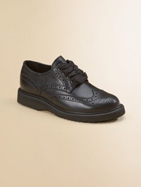 Wingtip perforations give these supple leather lace-ups classic appeal.Leather upper Rubber sole Imported
