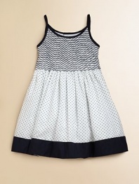 Crafted in plush cotton, this fancy frock's smocked bodice, full skirt and perky polka dots complete the look.Spaghetti strapsRound necklineButton backSmocked bodiceBack tie waistFull skirtFully linedCottonMachine wash coldImported Please note: Number of buttons may vary depending on size ordered. 