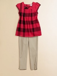Large, colorful checks and a flared hem add to the allure of this tasteful knit.SquareneckShort sleevesBack button closurePintucked frontFlared hemCottonDry cleanImported Please note: Number of buttons may vary depending on size ordered. 