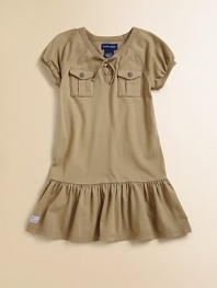 This drop-waist, cargo-inspired frock is the perfect mix of utility and girlie style.V-neck with lace-up frontShort puffed sleevesFront button placketButton-through bellows pocketsDrop-waist skirt with ruffled hemCottonMachine washImported Please note: Number of buttons may vary depending on size ordered. 