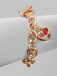 A warm rose goldtone style with colorful rhinestone accented heart-shaped charm on a link chain. Rose goldtone brassGlass stonesLength, about 7½Toggle closureImported 