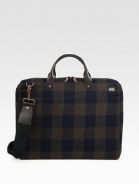 A lightly padded laptop case designed in rugged plaid-check wool with leather handles. Zip closure16L X 12H X 3DImported