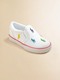 Smart, sturdy cotton canvas slip-ons, sprinkled with bright polo ponies, mix and match her summer play clothes.Cotton canvas upperElasticized side goresPlush terry liningRubber soleImported
