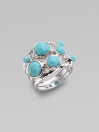 A wide ring, finished in the sophistication of turquoise, and exquisitely placed on a maze of sterling silver. Turquoise Sterling silver Width, about ¾ Imported