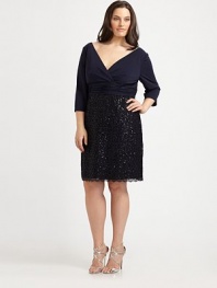 Wrapped in style, a matte jersey design with a flattering v-neck top, waist-flattering gathered details and a gorgeous sequin skirt.V-neckThree-quarter sleevesGathered waistSequin skirtBack zipperFully linedAbout 24 from natural waist70% rayon/30% polyesterDry cleanImported