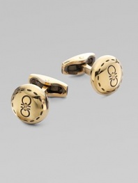 Round brass design engraved with iconic double gancini details, in a unique goldtone.BrassAbout ½ diam.Made in Italy