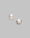Classic, elegant stud earrings set in 18K yellow gold. 4.5mm white cultured pearls 18K yellow gold Post backs Imported 