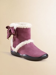 Shearling-lined boots with a suede bow.Shearling upper Rubber sole Imported