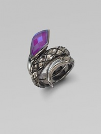 From the Queen Cobra Collection. A sensuous snake with textured scales of sterling silver and a faceted head of purple sugalite coils its way alluringly around the finger. Purple sugalite and hematite Sterling silver Width, about 1 Imported