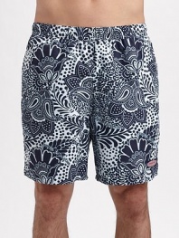 An eye-catching contrast paisley pattern lends modern style to an easy-fitting swim favorite. Elastic waist with internal drawstring Side slash, back patch pockets Mesh lining Inseam, about 7 Polyester Machine wash Imported 