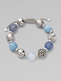 From the Elements Collection. Rich textures and soft shades combine in a stunning strand of 14mm sterling silver, blue chalcedony, aquamarine and moon quartz beads with a silver oval slide clasp.Blue chalcedony, aquamarine and moon quartzSterling silverDiameter, about 2Adjustable slide claspImported