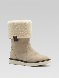 Sporty suede boots, cuffed and lined in curly, cozy shearling fleece.Suede upper Shearling cuff and lining Rubber sole Made in Italy