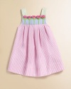 This beautiful seersucker frock is adorned with pastel-hued stripes and a row of pretty tulips.Square neckline with rosettesWide strapsBack zipperPleated empire waist55% cotton/45% polyesterMachine washImported
