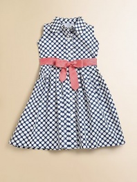 Bold polka dots create a fresh, modern look in a simple shirtdress with a wide grosgrain ribbon bow.Point collarSleevelessButtons from neck to hemContrast grosgrain ribbon bow beltFlared skirtCottonMachine washImported Please note: Number of buttons may vary depending on size ordered. 