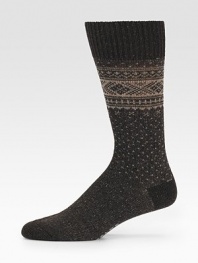 A timeless Nordic pattern is woven with the luxurious touch of merino wool. Ribbed toplineMid-calf height80% merino wool/20% polyamideMachine washMade in Germany