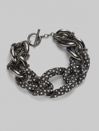 Multiple links with pavé detailing and delicate woven chain.Glass Metal Length, about 7½ Toggle closure Imported 