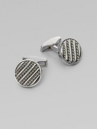 Round sterling silver links are set with hand-twisted wire inlaid within silver bars. Sterling silver About ½ diam. Made in the United Kingdom 