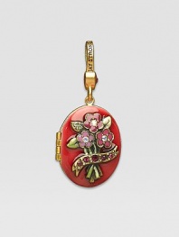 Ruby-colored CRYSTALLIZED - Swarovski Elements sparkle on this handcrafted, hand-enameled birthstone locket that opens to hold a favorite photo. Crystal Enamel 18k goldplated brass & brass-plated pewter Month indicated on the back Length, about 1¼ Width, about 1 Spring clip clasp Made in USA