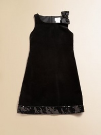 A cocktail dress for the pre-cocktail set, sweet and sophisticated in plush velvet with sequined trim.Squared neckline with sequined bow at one shoulderSleevelessSlight A-line shapeHidden back zipperSequined hem borderFully linedCottonMachine washImported