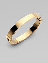 A thin goldtone design with hinge closure, perfect for stacking. Goldtone steelDiameter, about 2¾Hinged closureImported 