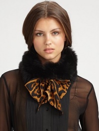 Make a statement with this luxurious, tie front design trimmed in dyed fox fur. 30% virgin wool/30% cashmere/40% silkAbout 7 X 59Specialist dry cleanMade in Italy Fur origin: Finland 