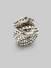 From the Naga Collection. A powerful dragon with dotted scales coils around the finger in this dramatic design. Sterling silver Width, about ¾ Made in Bali