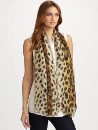 Fine silk woven enhanced with an exotic leopard print pattern.About 39 X 71 Dry clean Made in Italy 