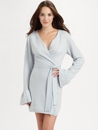 A flattering style with playfully romantic ruffled cuffs in luxuriously soft cashmere. V-neckLong sleeves with ruffled cuffsWrap front closureTie beltRolled hemAbout 36 from shoulder to hemCashmereDry cleanImported 