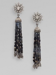 A crystal encrusted star-burst sits atop a long beaded tassel. Glass crystals Gunmetal-finished glass beads Pewter and brass Drop, about 5¾ Clip-on back Made in USA 