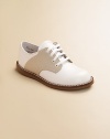 Timeless classics for school and play provide excellent support and cushioning in hard-wearing leather. Adjustrable front laces Padded insole Rubber traction sole Leather Imported Please note: It is recommended that you order ½ size smaller than measured. If your child measures a size 7.0, you may want to order a 6½. 