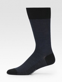 An elegant business look with the comfort and durability of fine merino wool. Ribbed toplineMid-calf height80% merino wool/20% polyamideMachine washMade in Germany