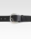 A nubuck leather belt with round buckle and cut-out logo detail. Dark palladium buckle 1.6 wide Made in Italy 