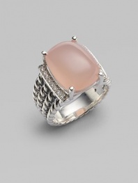 From the Wheaton Collection. A faceted cushion of milky pink opal, edged by rows of diamonds, in a wide cable band of sterling silver.Diamonds, 0.16 tcw Pink opal Sterling silver Width, about ½ Imported