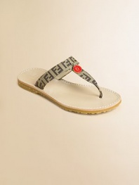 Accented by designer logos, these chic t-strap sandals are on every girl's most-wanted list.Slip-onCanvas upperRubber soleLogo pendantImportedAdditional InformationKid's Shoe Size Guide (European Equivalent) 