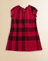 A sweet and simple little frock in a large-scale, deep-toned check.Round neckline with tiny ruffle and soft gatheringShort, puff raglan sleeves with banded cuffsButton placketSlightly flared shapeCottonMachine washImported Please note: Number of buttons may vary depending on size ordered. 