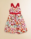 In cotton sateen with a painterly floral pattern and adorable grosgrain trim, this cross-back party dress is a must-have for stylish little ones.Spaghetti straps, cross at backGathered necklineConcealed back-zip closureGathered waist with grosgrain trimHem falls above kneeCottonDry cleanMade in USA of Italian fabrics