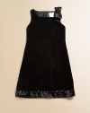 A cocktail dress for the pre-cocktail set, sweet and sophisticated in plush velvet with sequined trim.Squared neckline with sequined bow at one shoulderSleevelessSlight A-line shapeHidden back zipperSequined hem borderFully linedCottonMachine washImported