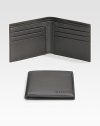 A classic leather bi-fold wallet with cut-out logo detail. Two bill compartments Six card slots 4.3W X 3.5H Made in Italy 