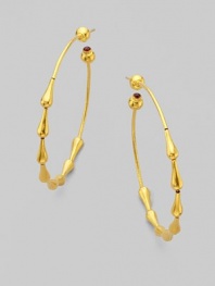 From the Spring Collection. Beautiful raindrops of 24k yellow gold trickle down in hoop shape and end with single ruby stones. 24k yellow gold Ruby Diameter, about 2 Post back Imported 