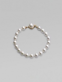 A single strand of round white pearls is an eternally elegant essential. 8mm white organic man-made pearls Length, about 7 18k goldplated sterling silver mabé pearl push-lock clasp Made in Spain