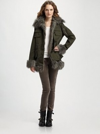 Military-inspired cargo pockets and plush faux-fur accent this chic cold-weather necessity. Detachable faux-fur collar Button front Front patch pockets Long sleeves with zipper detail Faux-fur cuffs and hem Detachable lining About 28 from shoulder to hem Faux fur: 85% acrylic/15% polyester Cotton shell and fill Hand wash Imported