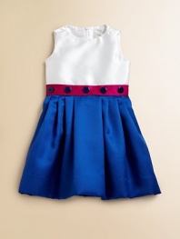 Crafted in a striking colorblock design, this cute-as-a-button frock is elegant in shiny satin with a full, pleated skirt.Jewelneck with rosette detailSleevelessBack zipperFull, pleated skirtPolyesterDry cleanMade in the USA