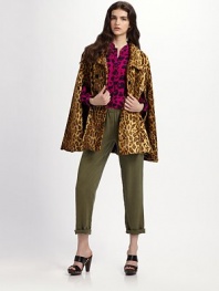 Channel retro-chic in this flares silhouette of faux leopard fur.Point collar Double-breasted button front Open sleeves Slash pockets About 30 from shoulder to hem 48% cotton/37% viscose/15% modal Dry clean Made in USA of imported fabric