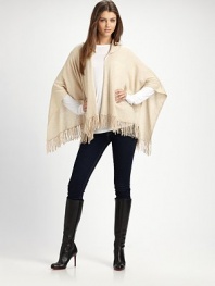 A casual style with an open drape front, warm hood and pretty fringe details in luxurious cashmere. HoodedOpen, draped frontPull-over styleFringed hemAbout 28 from back shoulder to hemCashmereDry cleanImported 