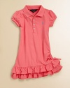 A cotton mesh polo dress teems with ruffles at the hem for a pretty update to a preppy essential.Ribbed polo collarShort capped sleevesButton frontSide ruchingTiered ruffle hem with bow detailCottonMachine washImported Please note: Number of buttons may vary depending on size ordered. 