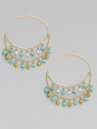 Delicate double hoops dangle tiny beads of turquoise, cultured pearls and 18k gold in this delightful design.Turquoise Cultured pearls 18k and 14k yellow gold Diameter, about ½ Post back Imported