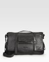 A smart option for any man on the move, styled in smooth leather with flap pockets on the outside and a padded laptop compartment on the inside. Top flap with buckle closures Top handles Adjustable, detachable shoulder strap Exterior flap pockets Interior zip, slip pockets Padded laptop compartment 16½W X 11H X 5D Imported 