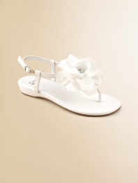A graceful satin T strap blooms with a floppy flower of chiffon and tulle with a rhinestone center.Terylene satin upperT strap thong with flowerBuckle ankle strapFaux leather sole with rubber insertPadded insoleFaux leather liningImported